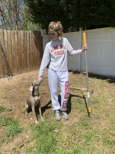 Whitney pausing from digging with her dog