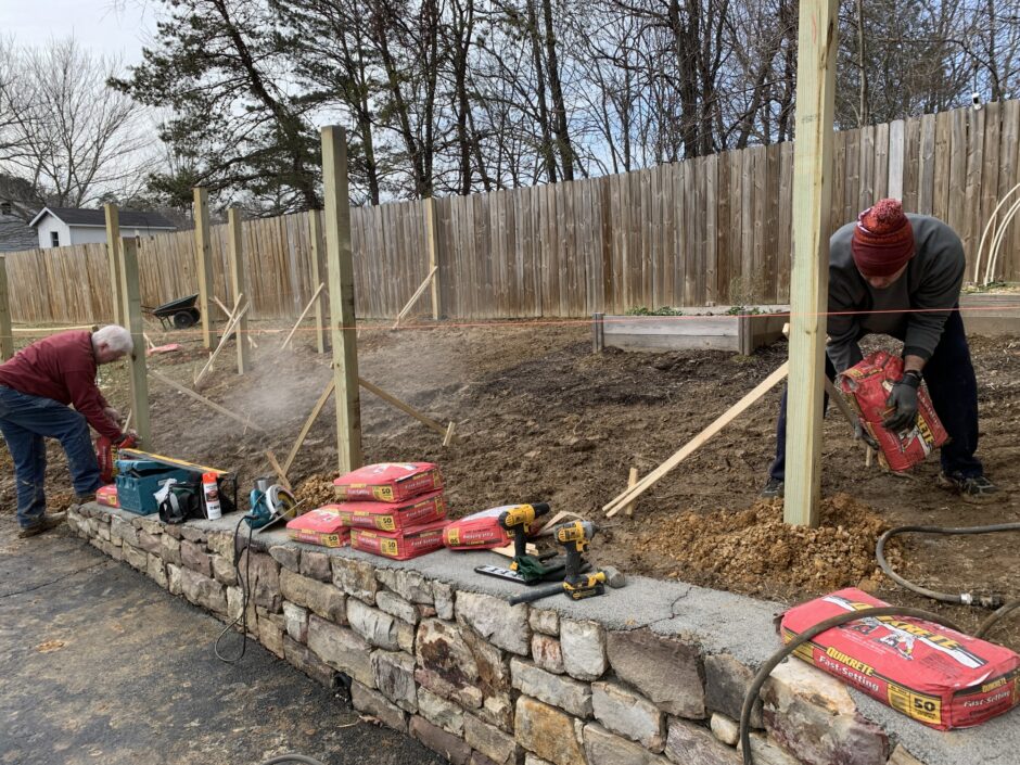 Posts are set and braced and now we are adding the concrete for the posts for the deer fence