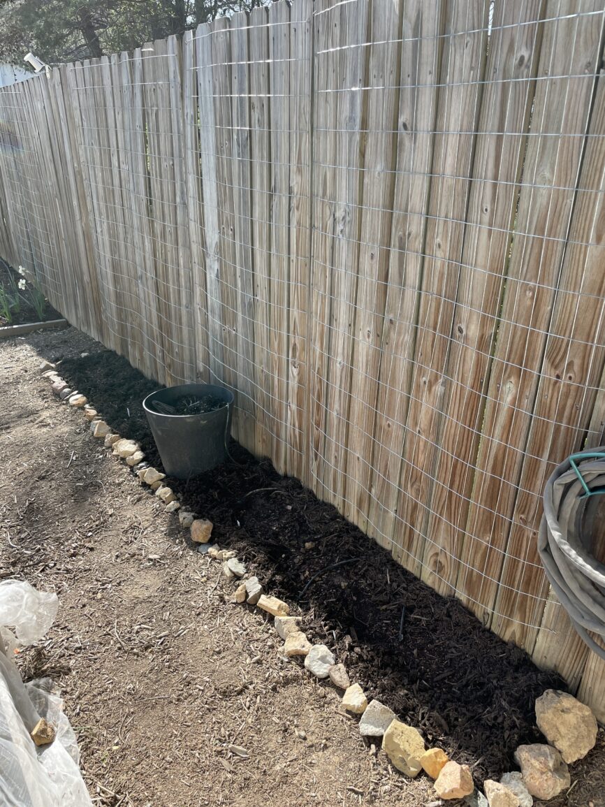 prepped bed along fence